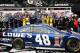 DAYTONA BEACH, FL - FEBRUARY 24: Jimmie Johnson, driver of the #48 Lowe's Chevrolet, hoists the Harley J. Earl trophy after winning the NASCAR Sprint Cup Series Daytona 500 at Daytona International Speedway on February 24, 2013 in Daytona Beach, Florida. (Photo by Jerry Markland/Getty Images)