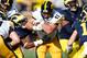 ANN ARBOR, MI - NOVEMBER 17: Mark Weisman #45 of the Iowa Hawkeyes tries to split the tackles of Jibreel Black #55 and Courtney Avery #5 of the Michigan Wolverines at Michigan Stadium on November 17, 2012 in Ann Arbor, Michigan. (Photo by Gregory Shamus/Getty Images)