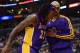 LOS ANGELES, CA - JANUARY 04: Jordan Hill #27 of the Los Angeles Lakers gets helped off the court by Robert Sacre #50 during a 107-102 Los Angeles Clipper win at Staples Center on January 4, 2013 in Los Angeles, California. NOTE TO USER: User expressly acknowledges and agrees that, by downloading and or using this photograph, User is consenting to the terms and conditions of the Getty Images License Agreement. (Photo by Harry How/Getty Images)