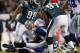 PHILADELPHIA, PA - OCTOBER 30: Quarterback Tony Romo #9 of the Dallas Cowboys is sacked by Trent Cole #58 of the Philadelphia Eagles as teammates Mike Patterson #98 and Cullen Jenkins #97 look on during a game at Lincoln Financial Field on October 30, 2011 in Philadelphia, Pennsylvania. The Eagles defeated the Cowboys 34-7. (Photo by Rich Schultz/Getty Images)