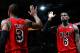 ATLANTA, GA - FEBRUARY 20: LeBron James #6 of the Miami Heat reacts with Dwyane Wade #3 after hitting a three-point basket against the Atlanta Hawks as time expired in the first half at Philips Arena on February 20, 2013 in Atlanta, Georgia. NOTE TO USER: User expressly acknowledges and agrees that, by downloading and or using this photograph, User is consenting to the terms and conditions of the Getty Images License Agreement. (Photo by Kevin C. Cox/Getty Images)