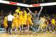 Feb 26, 2013; Minneapolis, MN, USA; Minnesota Gophers guard Joe Coleman (11) and forward Rodney Williams Jr. (33) and forward Trevor Mbakwe (32) and the team celebrate the win over the Indiana Hoosiers at Williams Arena. The Gophers defeated number one ranked Hoosiers 77-73. Mandatory Credit: Marilyn Indahl-USA TODAY Sports