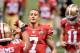 Feb 3, 2013; New Orleans, LA, USA; San Francisco 49ers quarterback Colin Kaepernick (7) exchanges a fist bump with running back LaMichael James (23) as quarterback Alex Smith (11) reacts during Super Bowl XLVII against the Baltimore Ravens at the Mercedes-Benz Superdome. Mandatory Credit: Kirby Lee-USA TODAY Sports