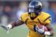December 1, 2012; Morgantown, WV, USA; West Virginia Mountaineers wide receiver Tavon Austin (1) carries the ball against the Kansas Jayhawks during the third quarter at Milan Puskar Field. The West Virginia Mountaineers won 59-10. Mandatory Credit: Charles LeClaire-USA TODAY Sports
