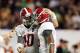 Jan 7, 2013; Miami, FL, USA; Alabama Crimson Tide quarterback A.J. McCarron (10) puts his arm around wide receiver Amari Cooper (9) as they come off the field following the third quarter of the 2013 BCS Championship game against the Notre Dame Fighting Irish at Sun Life Stadium. Mandatory Credit: Matthew Emmons-USA TODAY Sports