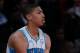 HOUSTON, TX - FEBRUARY 15: Anthony Davis #23 of the New Orleans Hornets and Team Chuck sits on the scorer's table in the first half in the BBVA Rising Stars Challenge 2013 part of the 2013 NBA All-Star Weekend at the Toyota Center on February 15, 2013 in Houston, Texas. NOTE TO USER: User expressly acknowledges and agrees that, by downloading and or using this photograph, User is consenting to the terms and conditions of the Getty Images License Agreement. (Photo by Ronald Martinez/Getty Images)