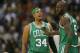 Feb 19, 2013; Denver, CO, USA; Boston Celtics forward Paul Pierce (34) talks with forward Kevin Garnett (5) during the second half against the Denver Nuggets at the Pepsi Center. The Nuggets won 97-90. Mandatory Credit: Chris Humphreys-USA TODAY Sports