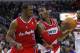 February 4, 2012; Washington, DC, USA; Washington Wizards point guard John Wall (center) dribbles the ball as Los Angeles Clippers point guard Chris Paul (3) defends in the first half at Verizon Center. Mandatory Credit: Geoff Burke-USA TODAY Sports