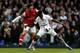 LONDON, ENGLAND - MARCH 03: Emmanuel Abebayor of Spurs is challenged by Mikel Arteta of Arsenal during the Barclays Premier League match between Tottenham Hotspur and Arsenal FC at White Hart Lane on March 3, 2013 in London, England. (Photo by Paul Gilham/Getty Images)