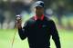 PALM BEACH GARDENS, FL - MARCH 03: Tiger Woods of USA reacts to the news that his ball had been found after he was unable to find it within the regulation five minutes. He then returned to the tee to play another shot on the sixth hole during the final round of the Honda Classic on March 3, 2013 in Palm Beach Gardens, Florida. (Photo by Stuart Franklin/Getty Images)