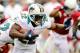 Sept. 30, 2012; Glendale, AZ, USA; Miami Dolphins running back Reggie Bush (22) runs with the ball during the second half against the Arizona Cardinals at University of Phoenix Stadium. The Cardinals beat the Dolphins 24-21. Mandatory Credit: Matt Kartozian-USA TODAY Sports