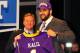 NEW YORK, NY - APRIL 26: Matt Kalil (R) from USC holds up a jersey as he stands on stage with NFL Commissioner Roger Goodell after he was selected #4 overall by the Minnesota Vikings in the first round of the 2012 NFL Draft at Radio City Music Hall on April 26, 2012 in New York City. (Photo by Al Bello/Getty Images)