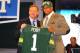 NEW YORK, NY - APRIL 26: Nick Perry (R) from USC holds up a jersey as he stands on stage with NFL Commissioner Roger Goodell after he was selected #28 overall by the Green Bay Packers in the first round of the 2012 NFL Draft at Radio City Music Hall on April 26, 2012 in New York City. (Photo by Al Bello/Getty Images)