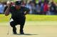 MIAMI, FL - MARCH 07: Tiger Woods lines up a putt on the fourth hole during the first round of the WGC-Cadillac Championship at the Trump Doral Golf Resort & Spa on March 7, 2013 in Miami, Florida. (Photo by Mike Ehrmann/Getty Images)