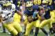 ANN ARBOR, MI - APRIL 16: Michael Shaw #20 runs for a short gain during the annual Spring Game at Michigan Stadium on April 16, 2011 in Ann Arbor, Michigan. (Photo by Leon Halip/Getty Images)