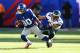 EAST RUTHERFORD, NJ - DECEMBER 30: Victor Cruz #80 of the New York Giants runs with the ball after a catch against Nnamdi Asomugha #24 of the Philadelphia Eagles in action during their game against the at MetLife Stadium on December 30, 2012 in East Rutherford, New Jersey. (Photo by Al Bello/Getty Images)