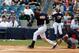 TAMPA, FL - MARCH 09: Infielder Derek Jeter #2 of the New York Yankees singles in the first inning against the Atlanta Braves during a Grapefruit League Spring Training Game at George M. Steinbrenner Field on March 9, 2013 in Tampa, Florida. (Photo by J. Meric/Getty Images)