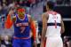 WASHINGTON, DC - MARCH 01: Carmelo Anthony #7 of the New York Knicks celebrates in front of Trevor Ariza #1 of the Washington Wizards after hitting a three point basket during the second half of the Knicks 96-88 win at Verizon Center on March 1, 2013 in Washington, DC. NOTE TO USER: User expressly acknowledges and agrees that, by downloading and or using this photograph, User is consenting to the terms and conditions of the Getty Images License Agreement. (Photo by Rob Carr/Getty Images)