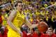 ANN ARBOR, MI - FEBRUARY 05: Nik Stauskas #11 of the Michigan Wolverines dribbles away from Sam Thompson #12 of the Ohio State Buckeyes at Crisler Center on February 5, 2013 in Ann Arbor, Michigan. Michigan won the game 76-74 in overtime. (Photo by Gregory Shamus/Getty Images)