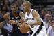 SAN ANTONIO, TX - APRIL 27: Tony Parker #9 of the San Antionio Spurs drives against Mike Conley #11 of the Memphis Grizzlies in Game Five of the Western Conference Quarterfinals in the 2011 NBA Playoffs on April 27, 2011 at AT&T Center in San Antonio, Texas. NOTE TO USER: User expressly acknowledges and agrees that, by downloading and or using this photograph, User is consenting to the terms and conditions of the Getty Images License Agreement. (Photo by Jed Jacobsohn/Getty Images)