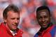 AUGUST 3: Quarterback Joe Montana #16 and wide receiver Jerry Rice #80 of the San Francisco 49ers look on during a preseason game against the Denver Broncos on August 3, 1992. The 49ers won 13-7. (Photo by George Rose/Getty Images)