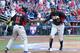 PHOENIX, AZ - MARCH 10: Adam Jones #10 of USA celebrates with Jimmy Rollins #11 after scoring a run against Canada during the eighth inning of the World Baseball Classic First Round Group D game at Chase Field on March 10, 2013 in Phoenix, Arizona. USA defeated Canada 9-4. (Photo by Christian Petersen/Getty Images)