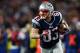 FOXBORO, MA - JANUARY 13: Wes Welker #83 of the New England Patriots runs with the ball against the Houston Texans during the 2013 AFC Divisional Playoffs game at Gillette Stadium on January 13, 2013 in Foxboro, Massachusetts. (Photo by Elsa/Getty Images)