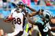 CHARLOTTE, NC - NOVEMBER 11: Demaryius Thomas #88 of the Denver Broncos stiff-arms Charles Godfrey #30 of the Carolina Panthers during play at Bank of America Stadium on November 11, 2012 in Charlotte, North Carolina. The Broncos won 36-14. (Photo by Grant Halverson/Getty Images)