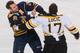 BUFFALO, NY - NOVEMBER 23: Paul Gaustad #28 of the Buffalo Sabres fights with Milan Lucic #17 of the Boston Bruins early in the first period at First Niagara Center on November 23, 2011 in Buffalo, New York. (Photo by Rick Stewart/Getty Images)