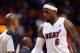 Mar 12, 2013; Miami, FL, USA; Miami Heat small forward LeBron James (right) talks with referee Derrick Stafford (left) during the first half against the Atlanta Hawks at American Airlines Arena. Mandatory Credit: Steve Mitchell-USA TODAY Sports