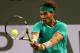 INDIAN WELLS, CA - MARCH 14: Rafael Nadal of Spain hits a return to Roger Federer of Switzerland during day 9 of the BNP Paribas Open at Indian Wells Tennis Garden on March 14, 2013 in Indian Wells, California. Nadal won 6-4, 6-2. (Photo by Stephen Dunn/Getty Images)