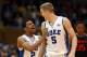 DURHAM, NC - MARCH 02: Quinn Cook #2 and teammate Mason Plumlee #5 of the Duke Blue Devils react after a play against the Miami Hurricanes during their game at Cameron Indoor Stadium on March 2, 2013 in Durham, North Carolina. (Photo by Streeter Lecka/Getty Images)