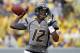 MORGANTOWN, WV - SEPTEMBER 22: Geno Smith #12 of the West Virginia Mountaineers drops back to pass against the Maryland Terrapins during the game on September 22, 2012 at Mountaineer Field in Morgantown, West Virginia. WVU defeated Maryland 31-21. (Photo by Justin K. Aller/Getty Images)