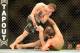 Mar 16, 2013; Montreal, Quebec, CAN; Rick Story (red gloves) knocks Quinn Mulhern (blue) to the mat during their preliminary round bout at UFC 158 at the Bell Centre. Mandatory Credit: Eric Bolte-USA TODAY Sports