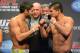 Mar 15, 2013; Montreal, Quebec, Canada; Patrick Cote (left) faces off with Bobby Voelker (right) while Dana White looks on during the weight-in for UFC 158 at the Bell Centre. Mandatory Credit: Eric Bolte-USA TODAY Sports