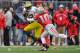 COLUMBUS, OH - NOVEMBER 24: Quarterback Devin Gardner #12 of the Michigan Wolverines tries to elude the tackle attempt of Ryan Shazier #10 of the Ohio State Buckeyes at Ohio Stadium on November 24, 2012 in Columbus, Ohio. (Photo by Jamie Sabau/Getty Images)