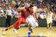 NASHVILLE, TN - MARCH 17: Marshall Henderson #22 of the Ole Miss Rebels drives past Scottie Wilbekin #5 of the Florida Gators in the second half of the SEC Basketball Tournament Championship game at Bridgestone Arena on March 17, 2013 in Nashville, Tennessee. (Photo by Andy Lyons/Getty Images)