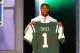 NEW YORK, NY - APRIL 26: Quinton Coples of North Carolina holds up a jersey as he stands on stage after he was selected #16 overall by the New York Jets in the first round of the 2012 NFL Draft at Radio City Music Hall on April 26, 2012 in New York City. (Photo by Al Bello/Getty Images)