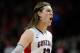 LAS VEGAS, NV - MARCH 11: Kelly Olynyk #13 of the Gonzaga Bulldogs geatures as he runs up court during the championship game of the West Coast Conference Basketball tournament against the Saint Mary's Gaels at the Orleans Arena March 11, 2013 in Las Vegas, Nevada. Gonzaga won 65-51. (Photo by David Becker/Getty Images)