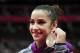 LONDON, ENGLAND - AUGUST 07: Bronze medalist Alexandra Raisman of the United States poses on the podium during the medal ceremony for the Artistic Gymnastics Women's Beam final on Day 11 of the London 2012 Olympic Games at North Greenwich Arena on August 7, 2012 in London, England. (Photo by Ronald Martinez/Getty Images)