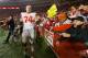 Nov 17, 2012; Madison, WI, USA; Ohio State Buckeyes offensive lineman Jack Mewhort (74) celebrates with fans following the game against the Wisconsin Badgers at Camp Randall Stadium. Ohio State defeated Wisconsin 21-14 in overtime. Mandatory Credit: Jeff Hanisch-USA TODAY Sports