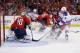 Washington's Braden Holtby attempts to make a save against the New York Rangers on March 10.
