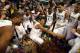GREENSBORO, NC - MARCH 17: Kenny Kadji #35 (C) of the Miami (Fl) Hurricanes celebrates with teammates after they won 87-77 against the North Carolina Tar Heels during the final of the Men's ACC Basketball Tournament at Greensboro Coliseum on March 17, 2013 in Greensboro, North Carolina. (Photo by Streeter Lecka/Getty Images)