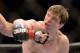 Mar 16, 2013; Montreal, Quebec, CAN; Darren Elkins (blue and Antonio Carvalho (red) throw simultaneous punches during their preliminary round bout at UFC 158 at the Bell Centre. Mandatory Credit: Eric Bolte-USA TODAY Sports