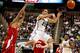 EAST LANSING, MI - MARCH 07: Travis Trice #20 of the Michigan State Spartans passes out of the paint in front of George Marshall #3 of the Wisconsin Badgers at the Jack T. Breslin Student Events Center on March 7, 2013 in East Lansing, Michigan. Michigan State won the game 58-43.(Photo by Gregory Shamus/Getty Images)