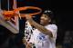 LAS VEGAS, NV - MARCH 16: Carlos Emory #33 of the Oregon Ducks celebrates by cutting down the net following his teams 78-69 victory over the UCLA Bruins during the Pac-12 Championship game at the MGM Grand Garden Arena on March 16, 2013 in Las Vegas, Nevada. (Photo by Jeff Gross/Getty Images)