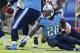 NASHVILLE, TN - NOVEMBER 4: Chris Johnson #28 of the Tennessee Titans fumbles the ball during a game against the Chicago Bears at LP Field on November 4, 2012 in Nashville, Tennessee. The Bears defeated the Titans 51-20. (Photo by Wesley Hitt/Getty Images)