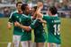 Jun 3, 2012; Arlington, TX, USA; Mexico forward Giovani dos Santos (10) and forward Javier Chicharito Hernandez (14) and midfielder Andres Guardado (18) celebrate a goal against Brazil during the first half at Cowboys Stadium. Mexico shut out Brazil 2-0. Mandatory Credit: Jerome Miron-USA TODAY Sports