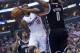 Mar 23, 2013; Los Angeles, CA, USA; Los Angeles Clippers guard Eric Bledsoe (12) is defended by Brooklyn Nets centerAndre Blatche (0) at the Staples Center. Mandatory Credit: Kirby Lee-USA TODAY Sports
