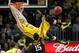 December 15, 2012; Brooklyn, NY, USA; Michigan Wolverines guard Nik Stauskas (11) misses a dunk over West Virginia Mountaineers guard Terry Henderson (15) during the first half of an NCAA men's basketball game at the Barclays Center. Mandatory Credit: Brad Penner-USA TODAY Sports